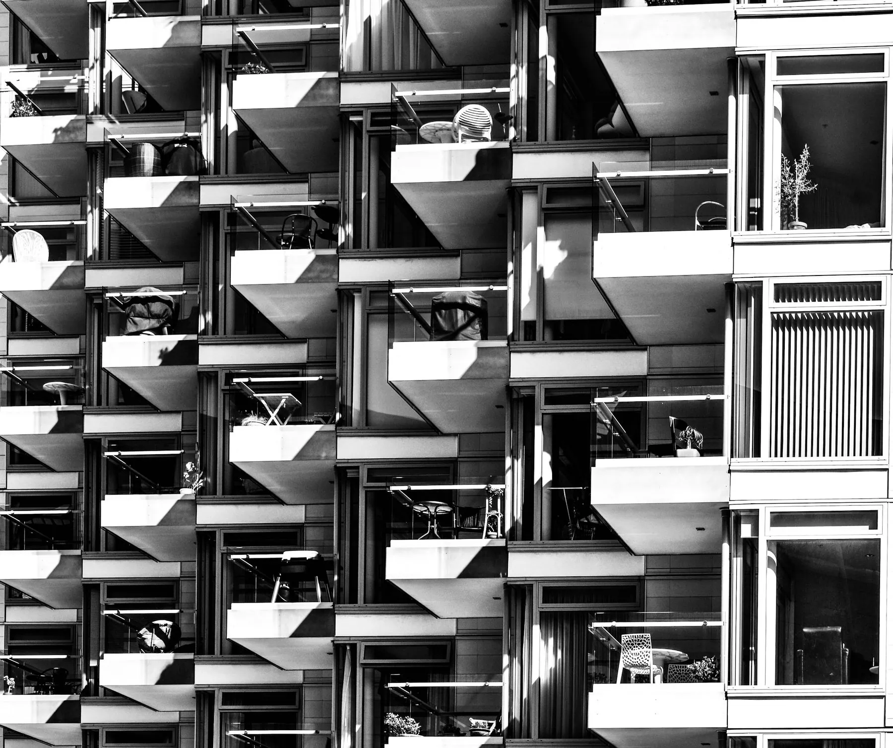 Geometric balconies create a complex pattern on a building facade