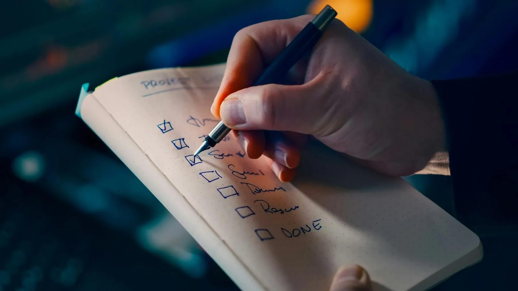 Project checklist planning productivity concept. Closeup hand writing tasks notebook pen focus workflow organization tim