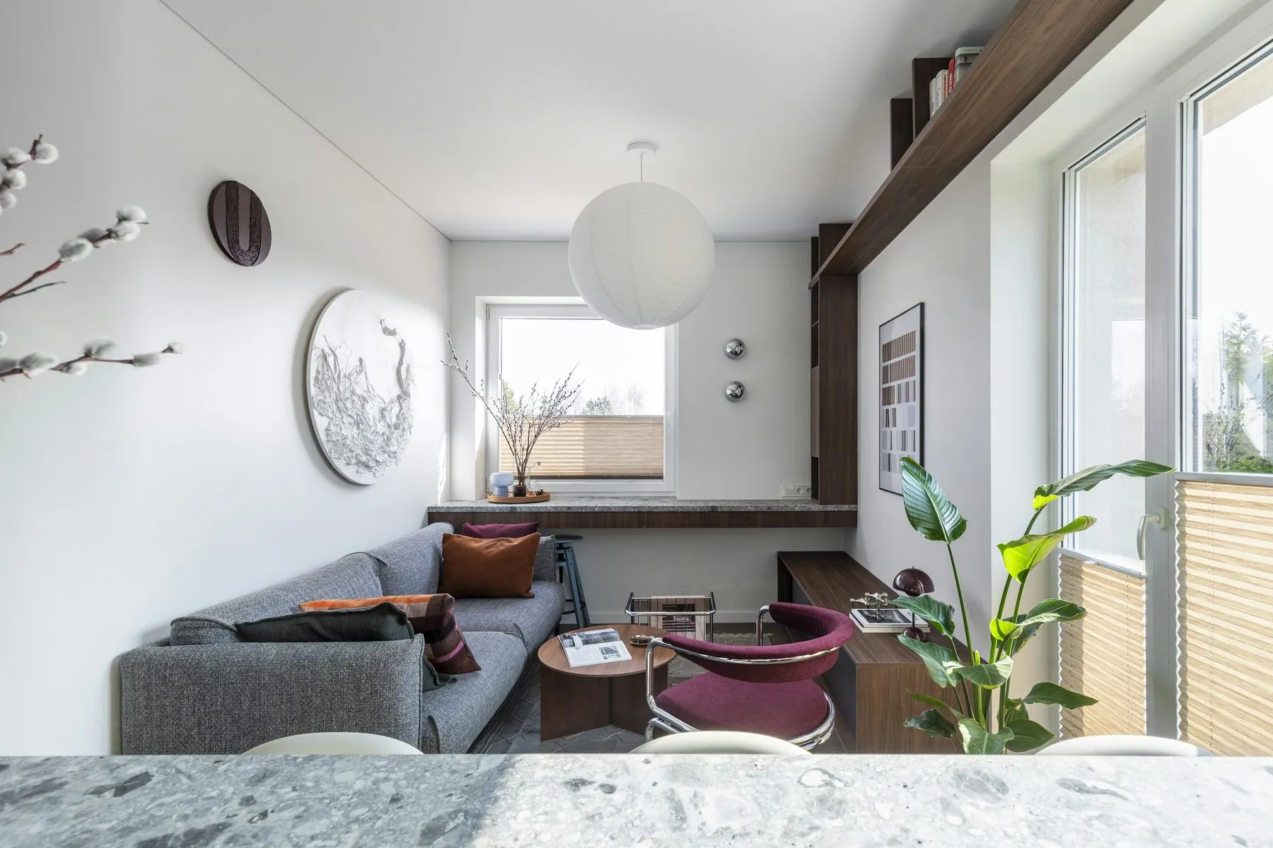 This 35 m² apartment in Vilnius is designed as a compact yet spatially fluid living environment, drawing on Mid-Century